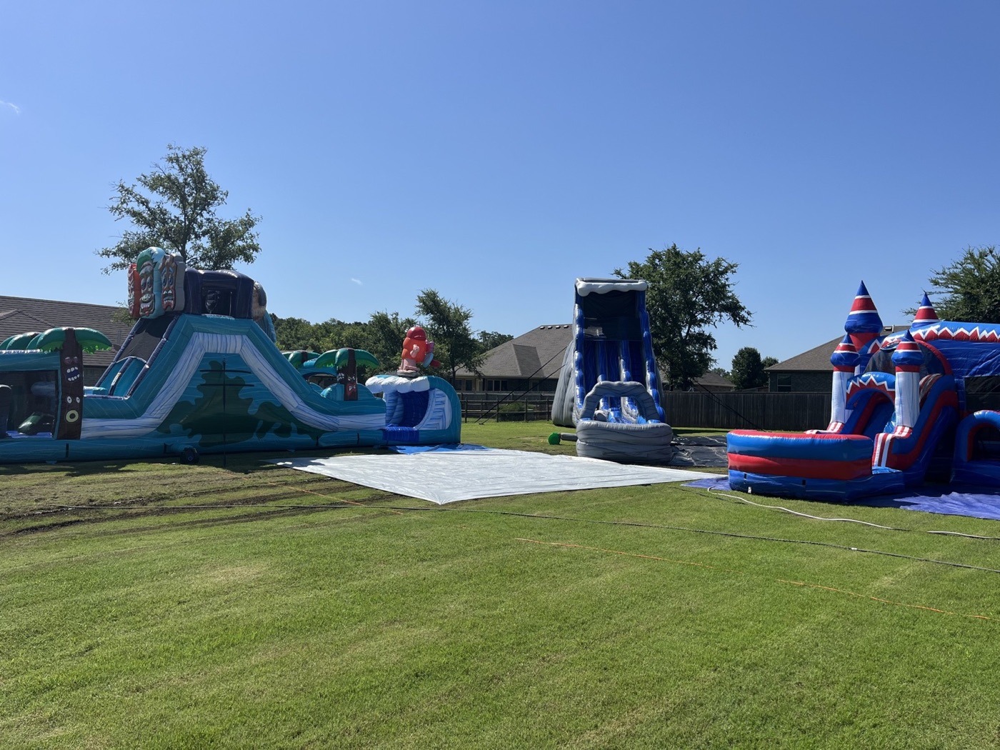 Several BISON inflatables set up on a large lawn