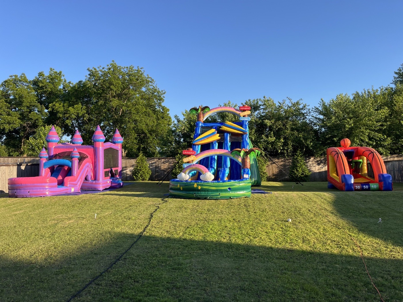 Combo inflatable and games set up for a backyard party