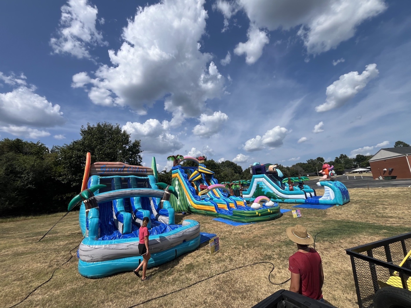 Water slides and party inflatables at a Tulsa area event